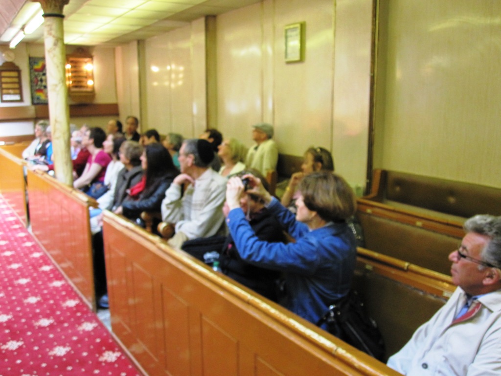 A group from South London Liberal Synagogue inside Fieldgate Street synagogue